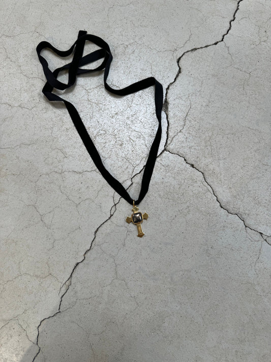 Cross on cord